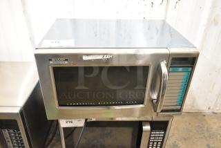 Sharp stainless steel commercial countertop microwave oven. 1000W R-21LV model. Handle broken; door cannot open.