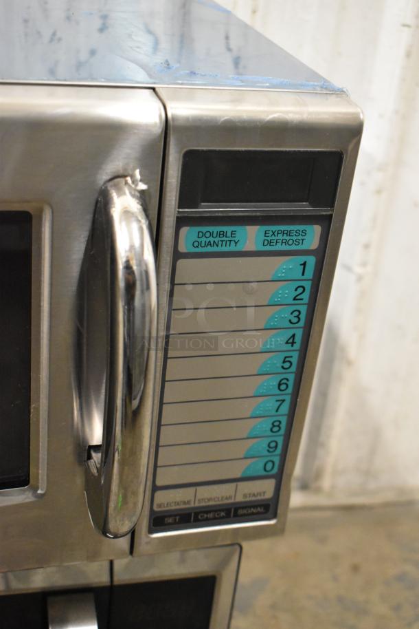 Sharp stainless steel commercial microwave oven, countertop model. Door handle broken, cannot open door, keypad visible.