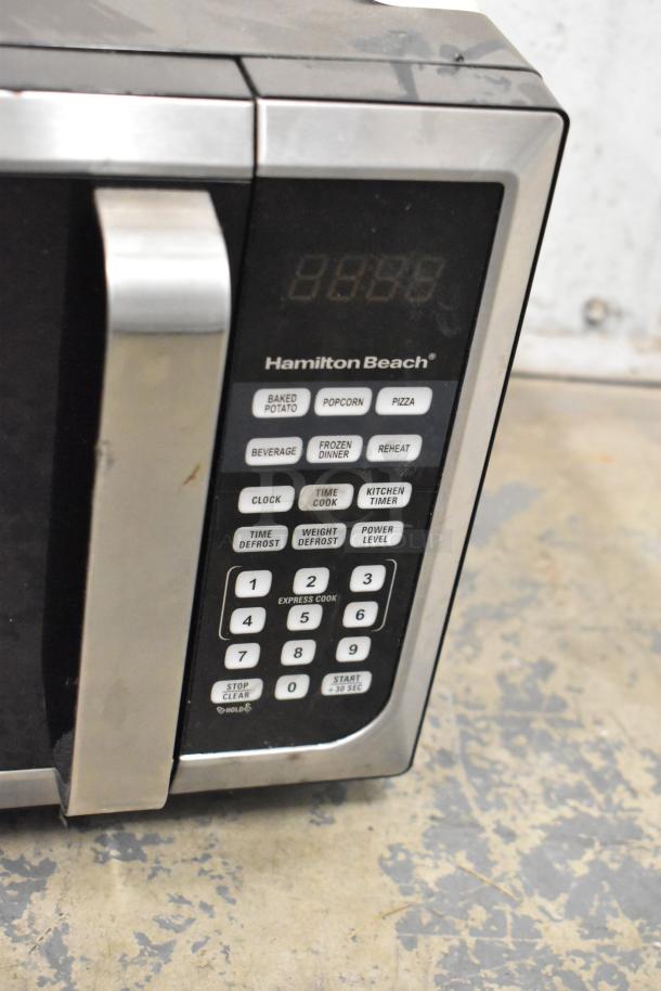 Hamilton Beach P90D23AL-WR stainless steel countertop microwave, 120V, visible touchpad with preset buttons, used condition.