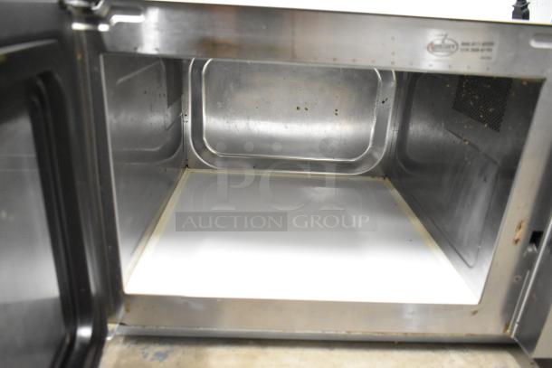 2022 Amana RCS10TS stainless steel commercial microwave oven, interior view. Condition shows signs of light use.