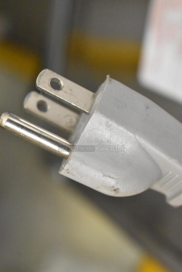 Close-up of a 3-prong power plug from a 2022 Amana RCS10TS commercial microwave oven. 120V, 1 phase.