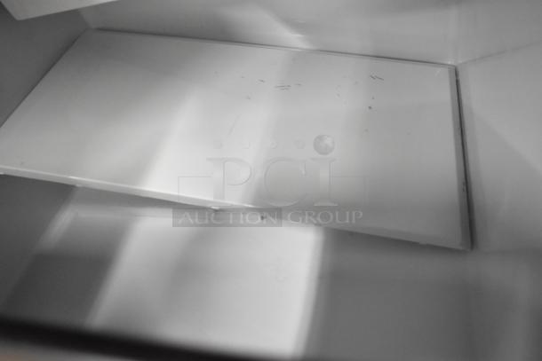 2024 Maxx Ice MIM250 stainless steel commercial ice machine interior view, showcasing clean surfaces and minor wear.