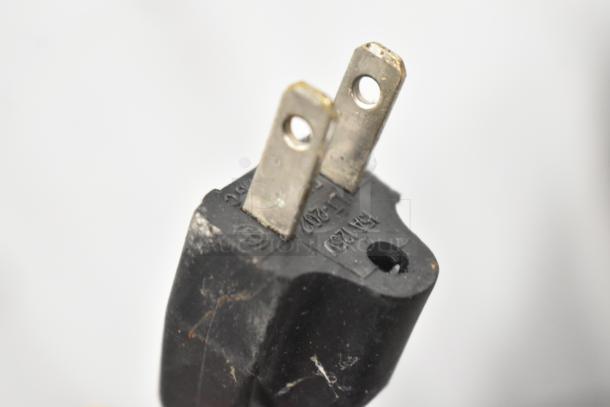 Close-up view of a plug from the 2016 Cadco Unox Roberta XAF003 convection oven, showing power details.