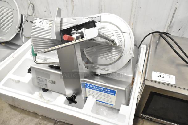 2016 Bizerba GSP HD commercial meat slicer, metal, 120V, 1 phase, with safety instructions visible, good condition.