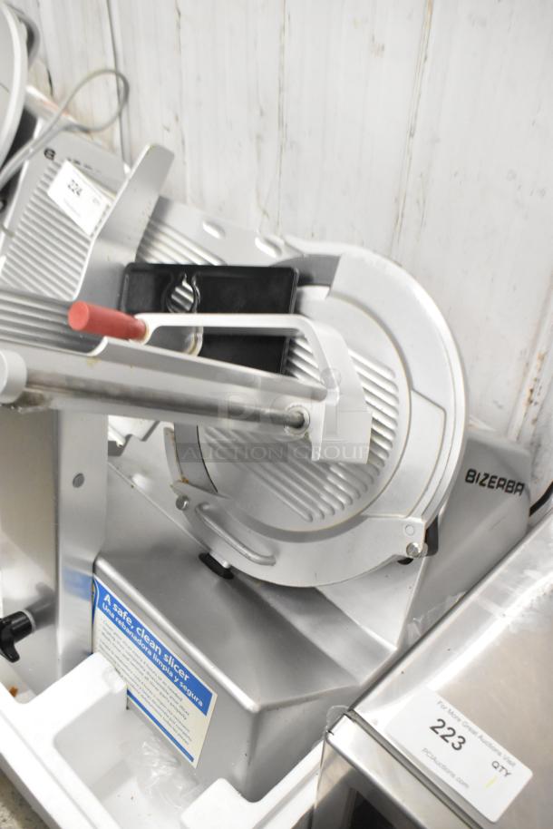 2016 Bizerba GSP HD metal meat slicer, commercial use, good condition, 120 volts, 1 phase, visible labels and markings.