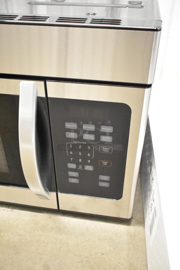 Brand new KoolMore KM-MOT-1SS 1.6 cu. ft. stainless steel microwave, 120V, with visible control panel, minor scratches.