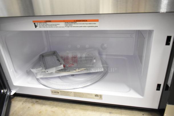 BRAND NEW SCRATCH AND DENT 2025 KoolMore KM-MOT-1SS over-the-range microwave, 1.6 cu. ft., stainless steel, 120 volts, with interior components inside.