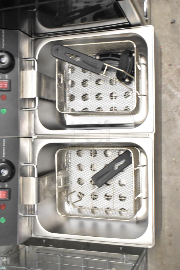 Brand new Galaxy 177EF20E dual tank electric fryer with two fry baskets, two lids, 20 lb. capacity, and control panel.