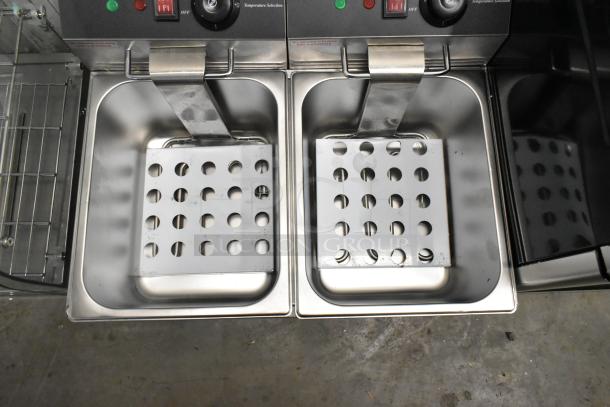 Brand new Galaxy 177EF20E dual tank electric fryer, 20 lb. capacity, with 2 baskets. 110V, 1 phase. Scratch and dent condition.