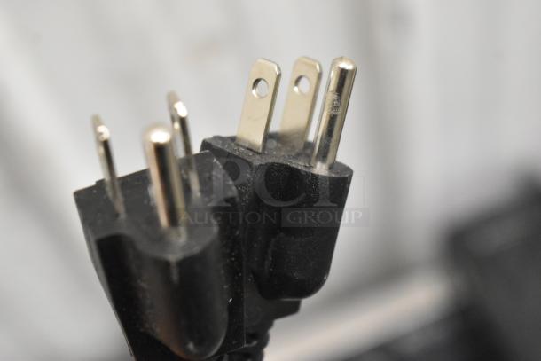 Close-up of a three-prong power plug for the Galaxy 177EF20E dual tank electric fryer, 110 volts, in new condition.