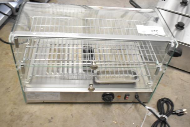Brand new KoolMore HDC-1.5C curved glass countertop display warmer, 110V, 1 Phase. Minor scratches. Dual shelves, control knob, power cord attached.
