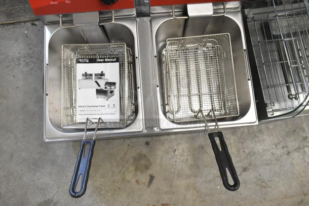Brand new Avantco 177F102 stainless steel 20 lb. dual tank electric fryer with two metal baskets and lids, 120V, includes manual.