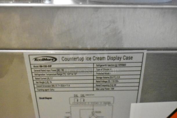 KoolMore KM-CGD-8HP stainless steel ice cream display case label. Includes dimensions, weight, and electrical info.