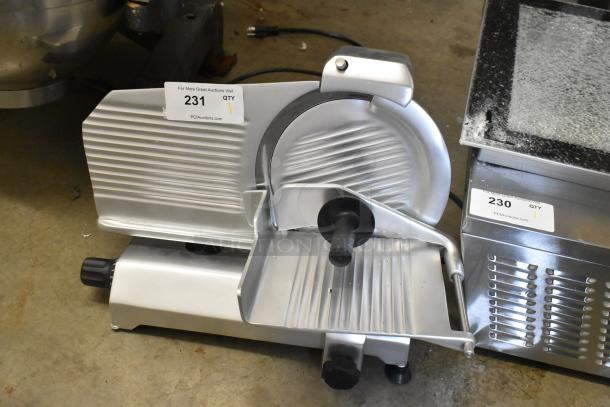 Brand new Globe C10 metal countertop meat slicer with blade sharpener, 115 volts, 1 phase, scratch and dent condition.