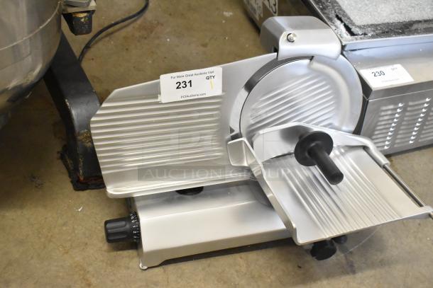 Brand new Globe C10 meat slicer, metal, with blade sharpener. Scratch and dent. 115V, 1 Phase. Auction label visible.
