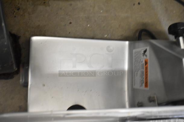 Brand new Globe C10 metal countertop meat slicer with blade sharpener. 115 volts, 1 phase. Scratch and dent condition.