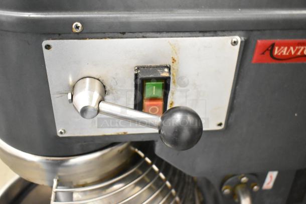 Avantco MX30 commercial mixer control panel with on/off switches and visible wear. Features metal bowl guard.