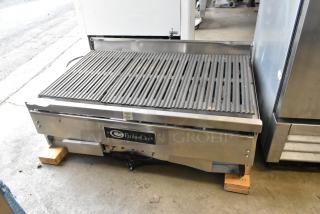 EmberGlo E2424 stainless steel commercial electric charbroiler grill, featuring a countertop design. Appears in fair condition.