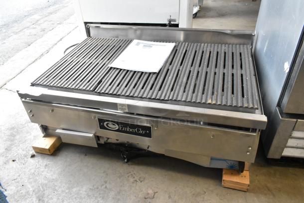 EmberGlo E2424 stainless steel commercial electric charbroiler grill, features durable grates and branded label, in good condition.