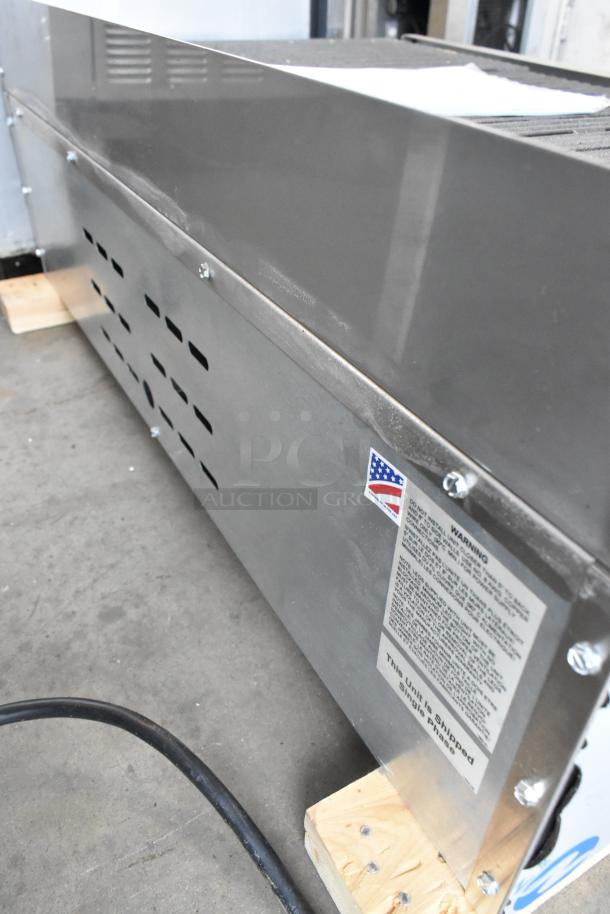 EmberGlo E2424 stainless steel electric charbroiler grill, commercial countertop model, features safety labels, gently used.