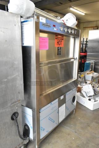 Douglas Stainless Steel Commercial Front Load Pot and Pan Washer with visible warning signs; good condition.
