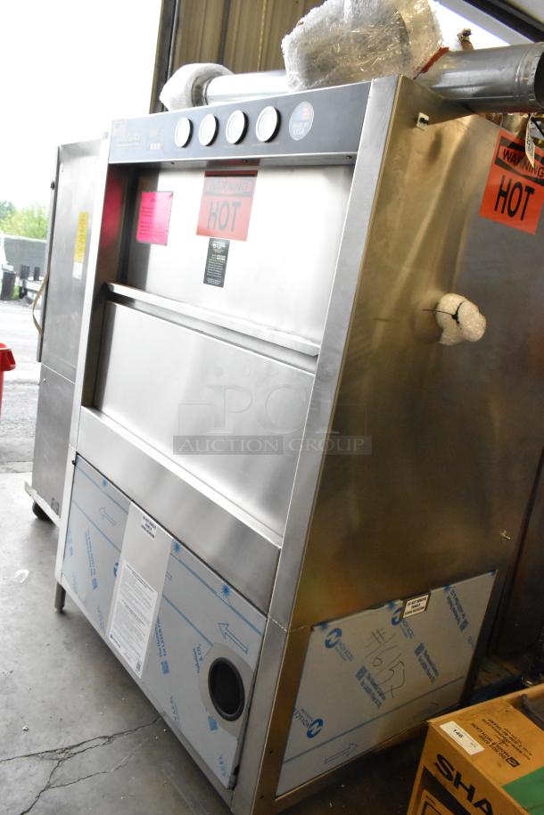 Douglas Stainless Steel Commercial Front Load Pot and Pan Washer in used condition, featuring visible warning labels.