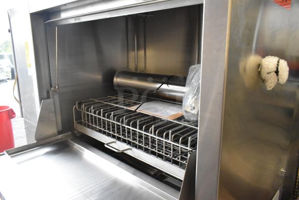 Douglas stainless steel commercial front-load pot and pan washer, featuring spacious interior and durable racks. Excellent condition.