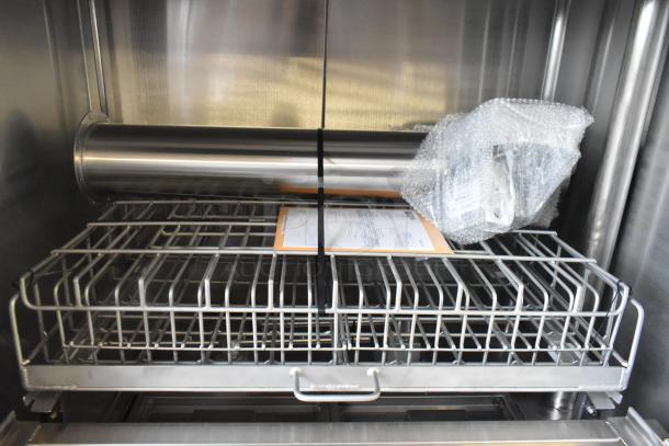Douglas stainless steel commercial front load pot and pan washer, includes rack and manual. Excellent condition.