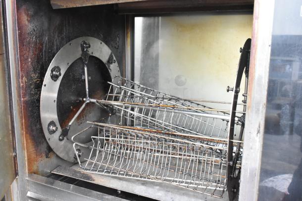 Fri-jado TDR7-P stainless steel commercial rotisserie oven, electric, 208V, 3 phase, on casters, used condition.