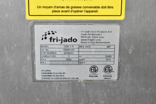 Fri-jado TDR7-P rotisserie oven with stainless steel body, commercial casters, and 208V, 3 phase power. Labels indicate model and specs.