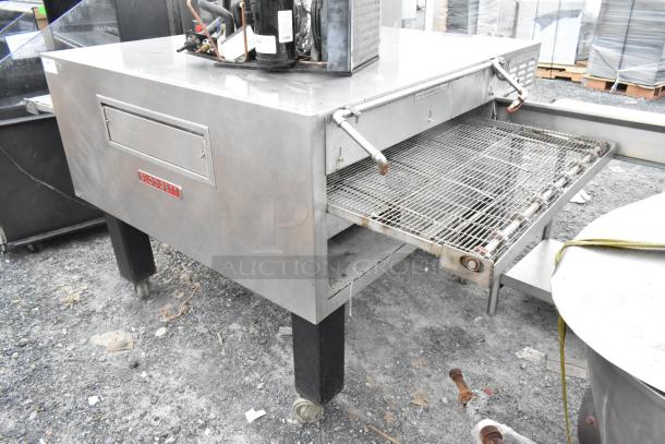 Blodgett MT3855G-G stainless steel conveyor oven, natural gas, 150,000 BTU, on commercial casters, single deck, floor style.
