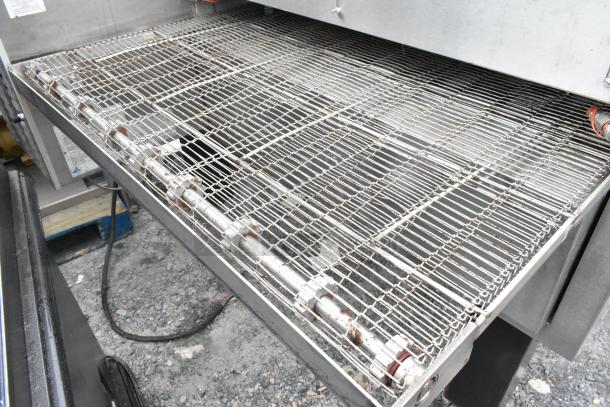 Blodgett MT3855G-G conveyor oven, stainless steel, single deck, natural gas, 150,000 BTU, on commercial casters.