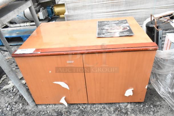 Wood Pattern 2 Door Cabinet, signs of wear, peeling stickers, label "250". Suitable for restoration or storage.