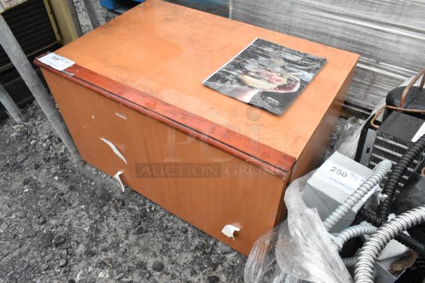 Wood Pattern 2 Door Cabinet with visible wear and peeling. Features a light finish and sturdy design, suitable for storage.