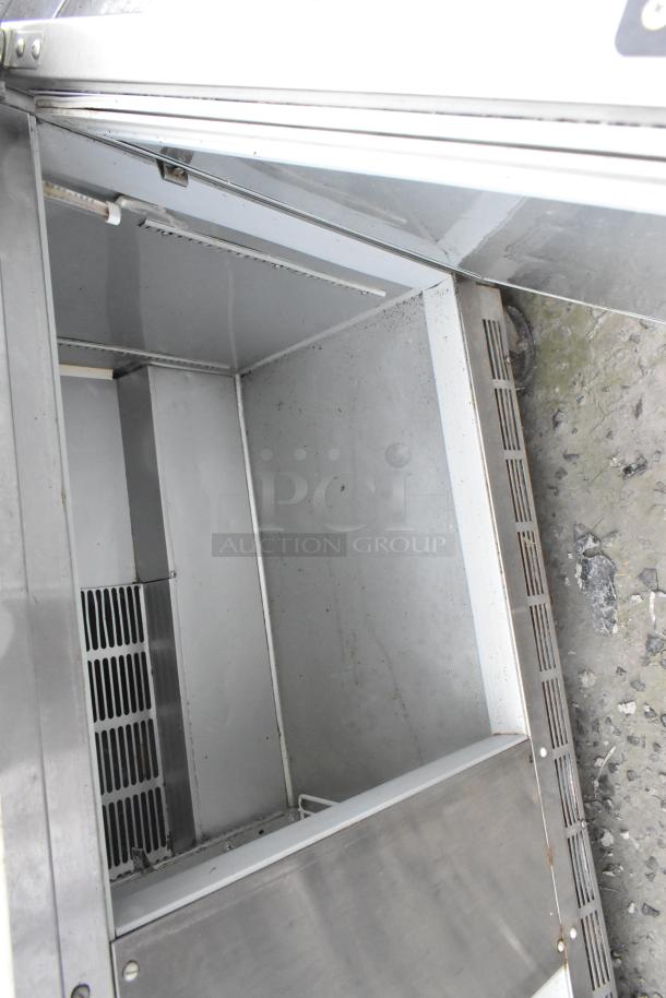 Beverage Air SPE60-16 stainless steel sandwich prep table, bain marie top, commercial casters, interior view, 115V.