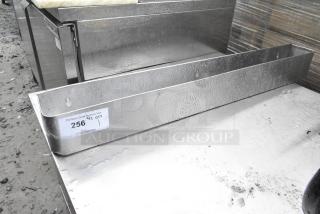 Stainless Steel Speewell with visible auction tag, slightly wet surface, rectangular shape, sturdy condition.