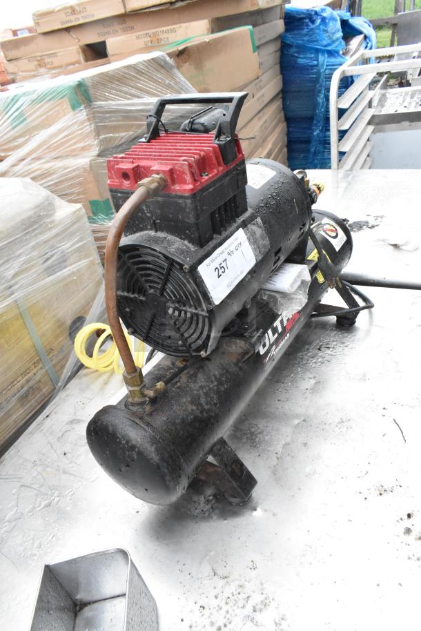 Thomas T-35HD M Ultra Air Pac Air Compressor, 115V, 1 Phase. Visible wear, labels intact. Compact, durable design for efficient use.