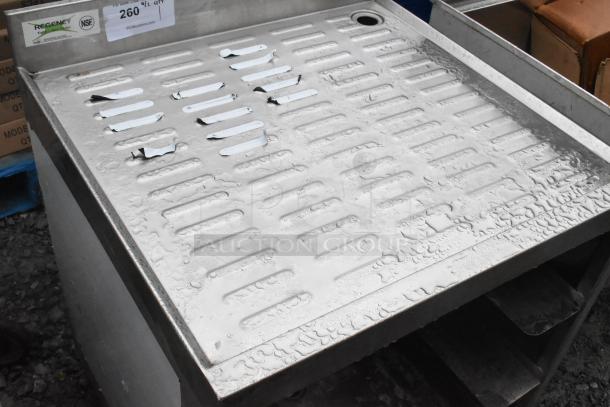 Regency 600GRSU2324C stainless steel drain board with perforated design, visible wear, NSF logo, and part number label.