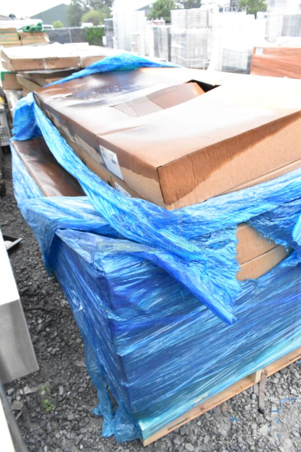 Nine new Advance Tabco TMS-306 72" stainless work tables in packaging, minor scratches, packed with blue wrap.
