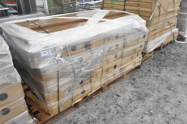 Pallet of 32 new scratch and dent items, Quantum Storage 2448BK shelves and P74P poles, wrapped in plastic wrap.