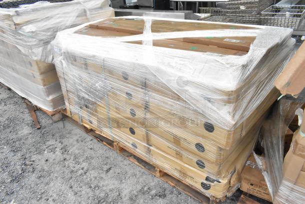 32 new scratch and dent items: Quantum Storage 2448BK wire shelves, P74P poles; pallet wrapped in plastic, visible boxes.