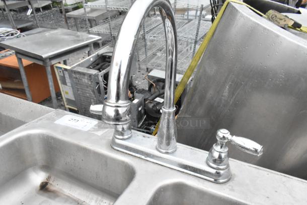 Metal 2 bay sink with faucet and handles, industrial design, silver finish. Visible label "273." Good used condition.