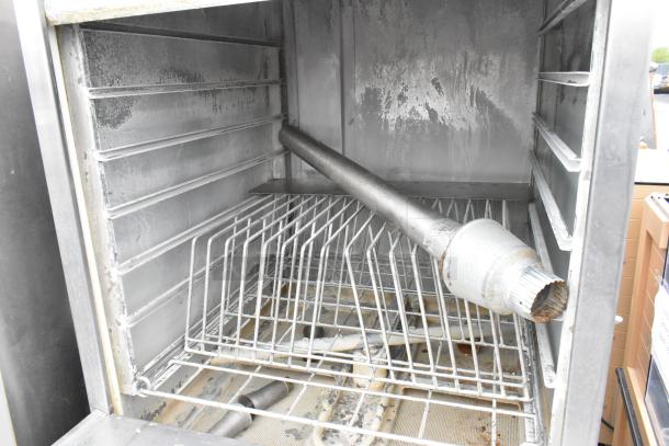 LVO FL14G stainless steel commercial pot and pan washer, 460V, 3 Phase. Interior view showing racks and spray arm.