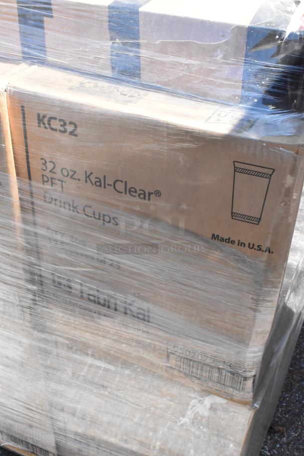 Boxes of KC32, 32 oz Kal Clear Drink Cups wrapped in plastic, labeled "Made in U.S.A." Scratch and dent condition.