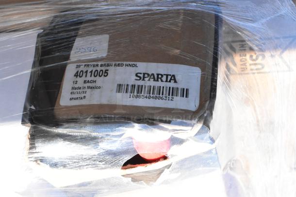 Boxes of mixed items including Sparta 4011005 Fryer Brush with visible label, wrapped in plastic, ready for auction.