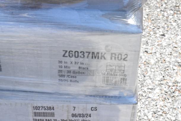 Boxes of Z6037MK R02 trash bags, 30x37 in, 10 mic, black, 20-30 gallon, 500/case, 14.8 lbs net, wrapped in clear plastic.