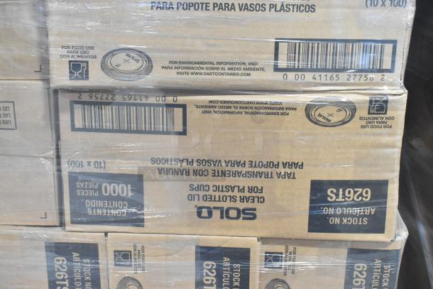 Boxes of Solo 626TS clear slotted lids, visible labels, stacked on a pallet. Brand new, scratch and dent condition.