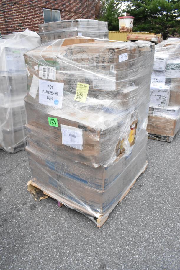 Pallet of 27 scratch and dent items including towels, bakery boxes, cups, napkins, sealed in plastic wrap with labels.