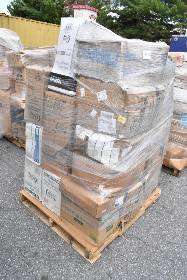 Pallet of 32 brand new scratch and dent wholesale items, including T-shirt bags, portion cups, cold cups, and towels, wrapped in plastic.