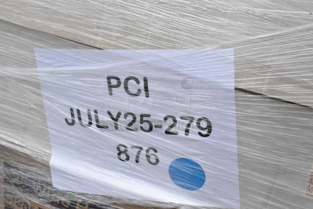 Auction lot of 36 brand new scratch and dent items wrapped in plastic, including cutlery, towels, and more. Label reads "PCI JULY25-279 876".